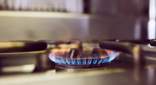Closeup of burning gas on the kitchen gas stove