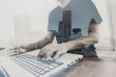 Double exposure of businessman working with new modern computer