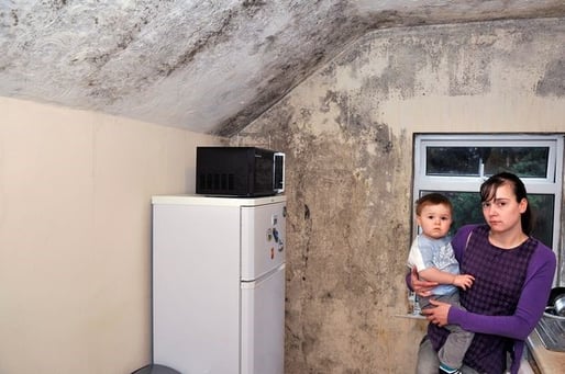 Charlotte Wicks and her fifteen month old son Jacob in a their flat in Oxford Road, Reading