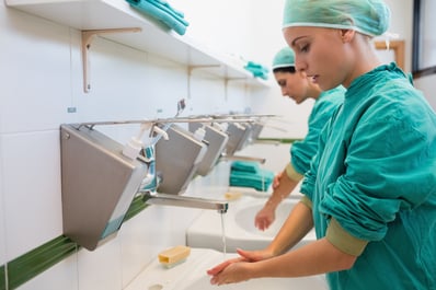 Two surgeons washing their hands in a hospital sink-1