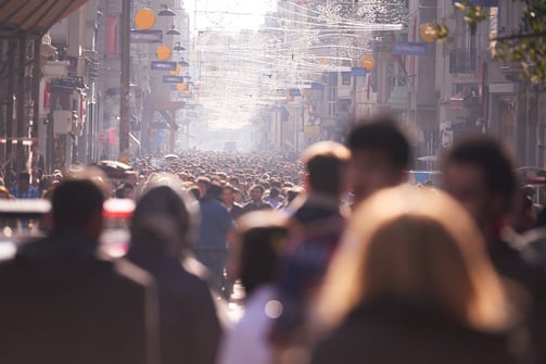 people crowd walking on busy street on daytime